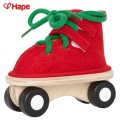 Hape - Дървена детска играчка обувка Червена